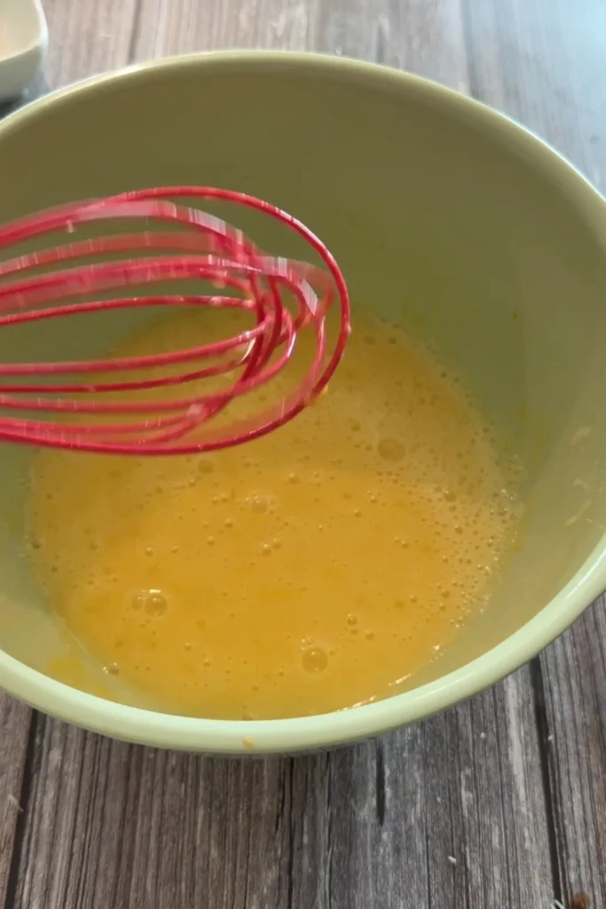 Whisked wet ingredients for homemade invisible apple cake.