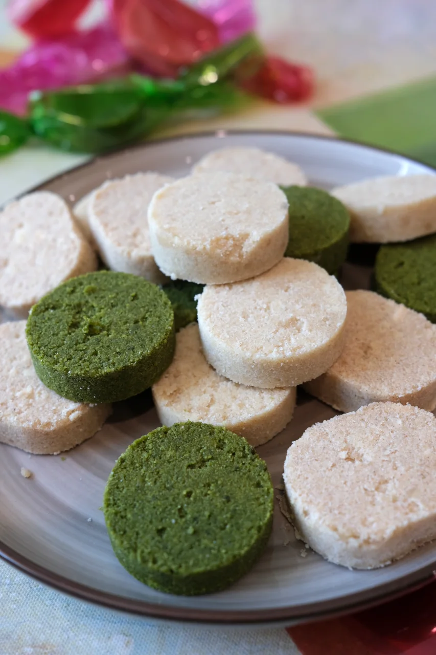 Close-up of homemade Filipino polvoron in classic, apple cinnamon, and matcha flavors.