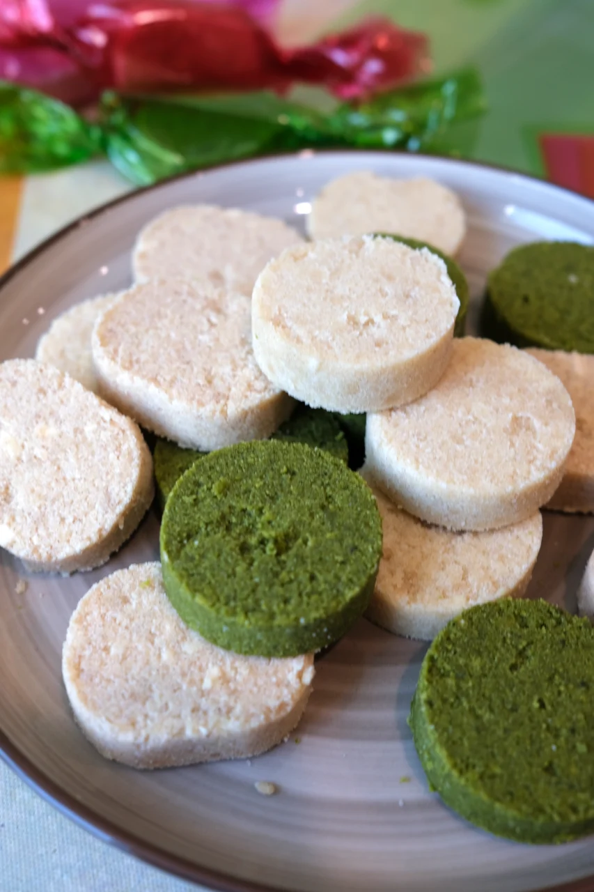 Close-up of homemade Filipino polvoron in classic, apple cinnamon, and matcha flavors.