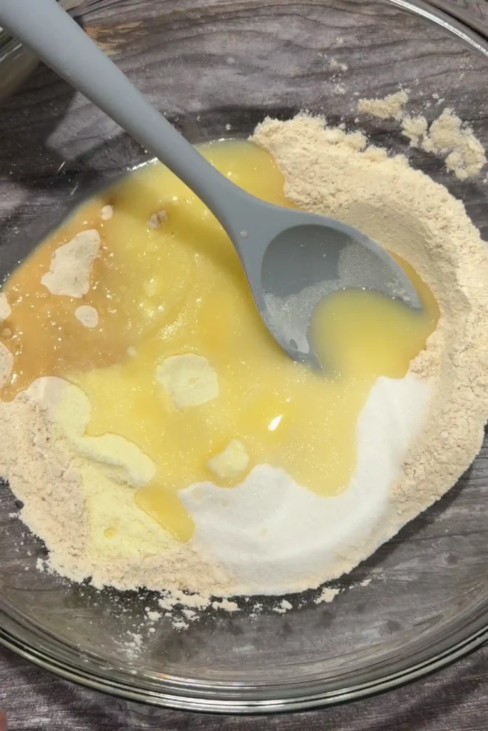 Melted butter and sugar added to the toasted flour mixture.