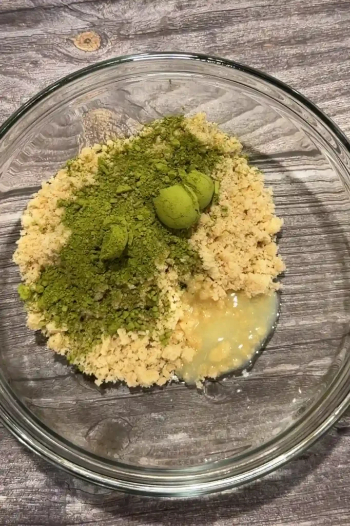 Matcha powder and melted butter added to the polvoron mixture.