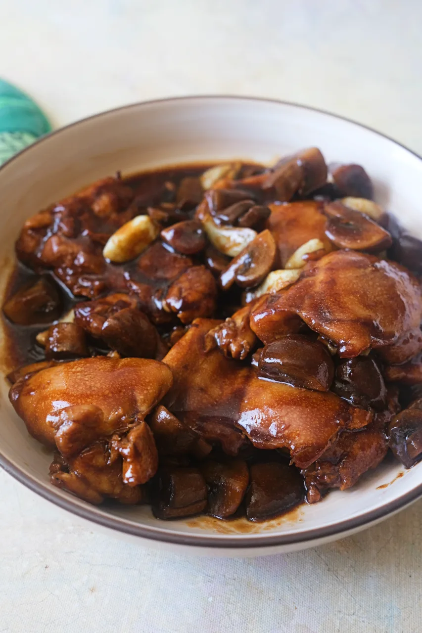 Chicken with mushroom gravy served with browned mushrooms and golden garlic.