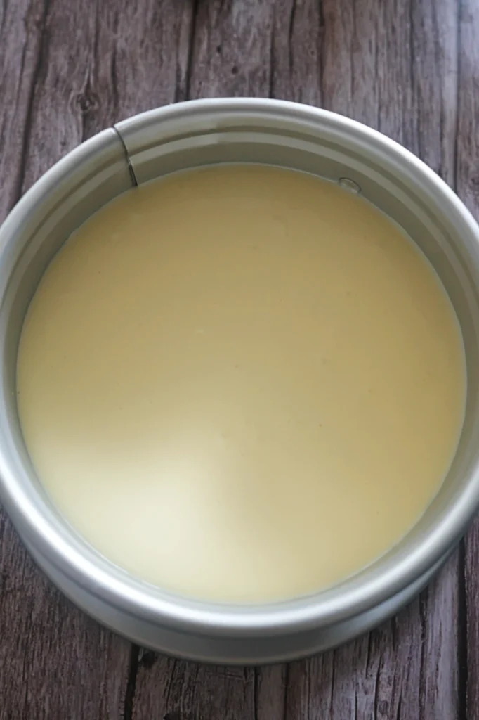 Keto cheesecake batter in a springform cake pan