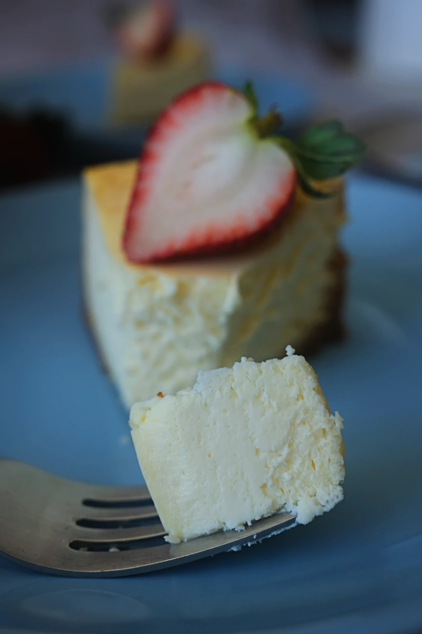 Slice of keto cheesecake on a blue plate