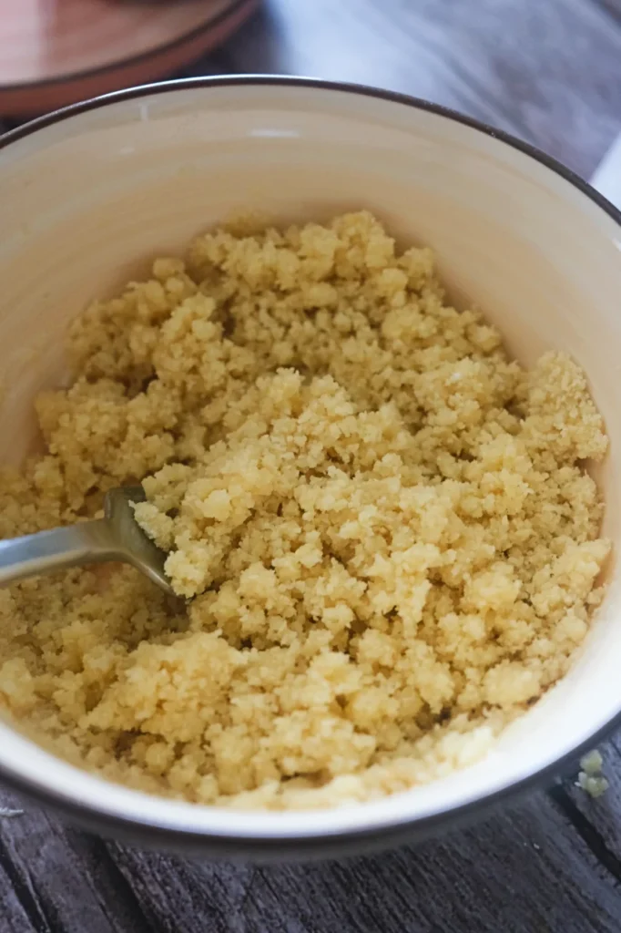 Almond flour crust mixture in a bowl
