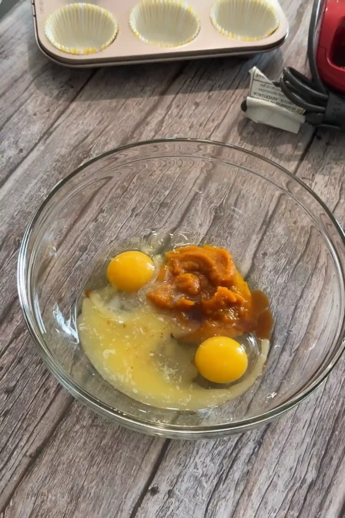 Pumpkin puree, eggs, melted butter, and vanilla in a separate mixing bowl.